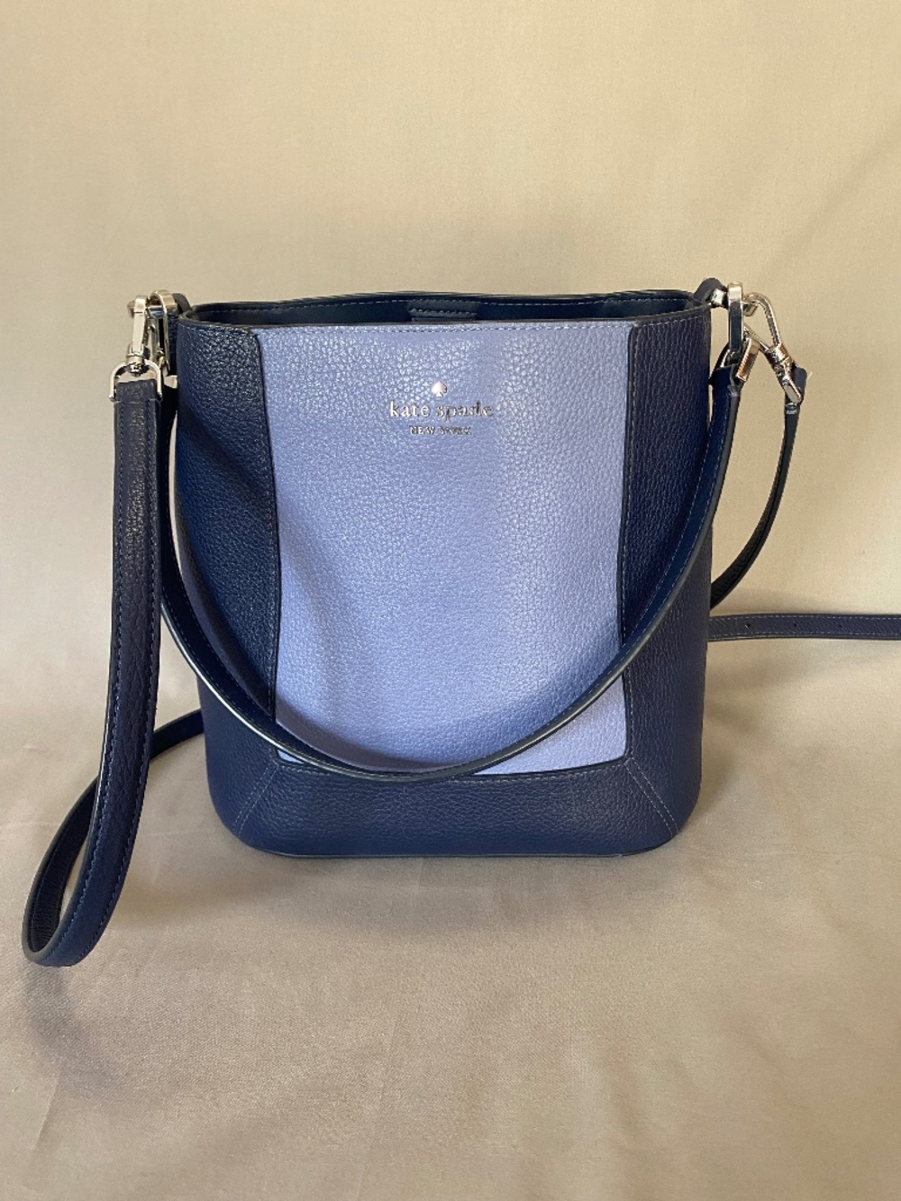 Kate Spade bucket style shoulder bag with adjustable strap, two-tone blue